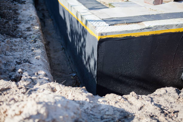 Professional Interior Drainage System technician working in Ashley, MI